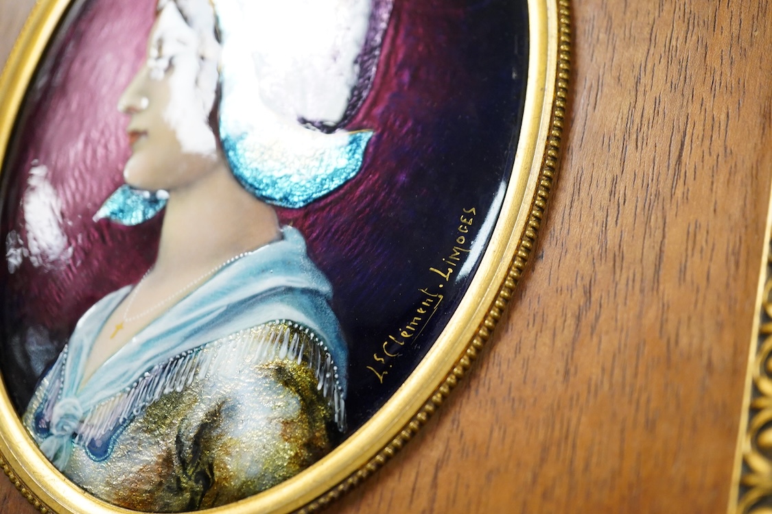 A Limoges framed oval enamel of a portrait of a lady, signed J Clement, 12cm.